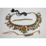 Two Indian bracelets made up of enamelled white metal links and an Indian white metal necklace