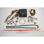 A suite of 1960's costume jewellery comprising earrings, necklace and bracelet, glass necklace