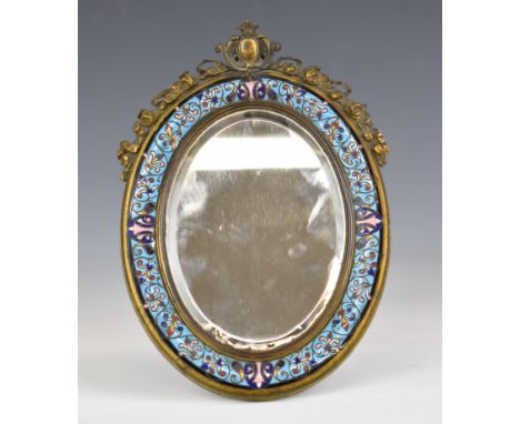 A 19thC brass and champlev&eacute; enamel easel back bevelled glass mirror with ornate surmount, 23 x 16cm
