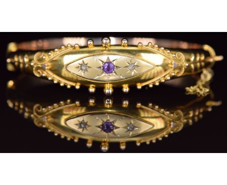 A 9ct gold bangle set with an amethyst and two old cut diamonds, Birmingham 1918, 12.2g, 6 x 5.2cm