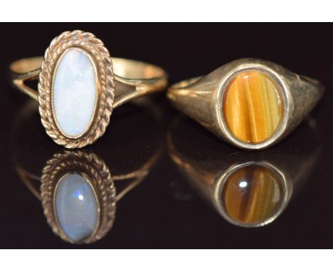 Two 9ct gold rings, one set with tiger's eye and one with opal, 3.3g, sizes l &amp; O