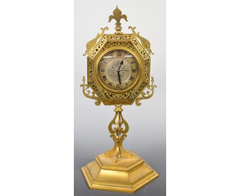 Late 19th or early 20th century fretwork mantel or desk clock, the silvered dial flanked by fish, all standing on a hexagonal