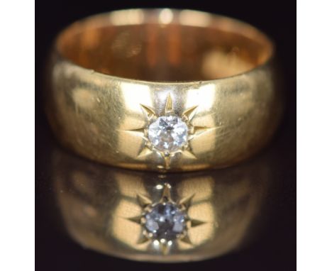 An 18ct gold ring set with an old cut diamond of approximately 0.2ct&nbsp;in a star setting, London 1917, 10.9g, size R