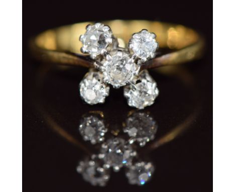 An 18k gold ring set with five old cut diamonds, 2.9g, size P