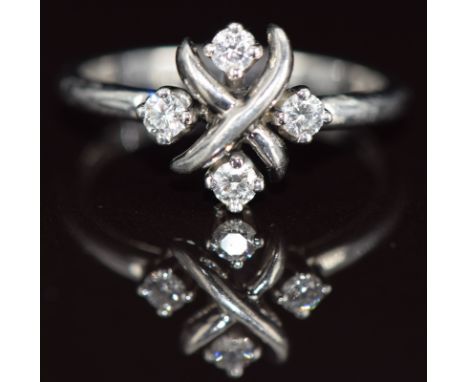 Tiffany &amp; Co platinum ring set with four diamonds in a cross design, 5.1g, size O&nbsp;