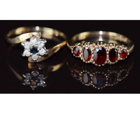 A 9ct gold ring set with five garnets and a 9ct gold ring set with a sapphire surrounded by diamonds, 3.8g, sizes R &amp; Q