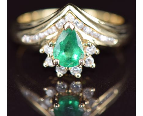 A 14k gold ring set with a pear cut emerald of approximately 0.4ct&nbsp;and diamonds, size M