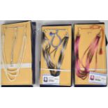 Three gem set necklaces including a seven strand ruby necklace, the total ruby weight
