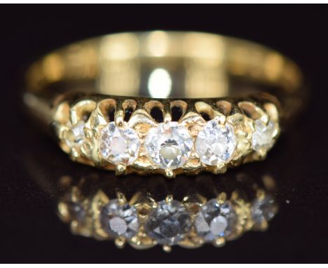 A c1900 18ct gold ring set with five old cut diamonds, 2.1g, size J
