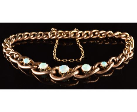 A c1900 9ct rose gold curb link bracelet set with five round cut opal cabochons, 10.3g, 18cm