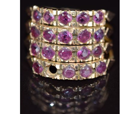 A 9ct gold ring made up of four rings each set with rubies (one missing), 4.1g, size K