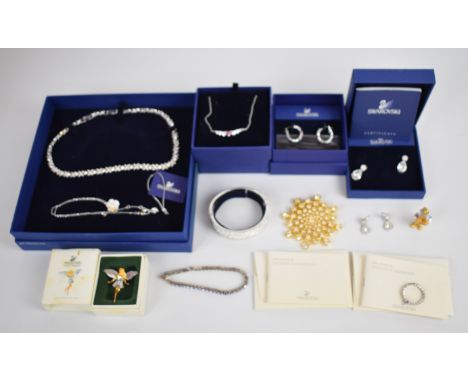 A collection of Swarovski jewellery including three necklaces, a bangle, bracelet, three pairs of earrings, ring and three br