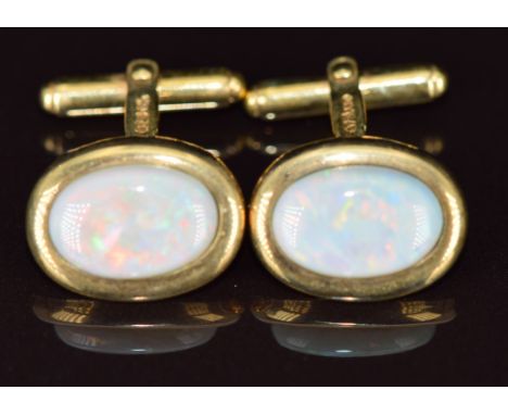 A pair of 9ct gold cufflinks each set with an opal, 6g&nbsp;