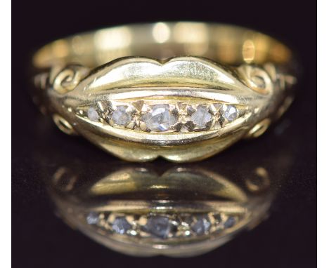 An 18ct gold ring set with diamonds, 2.9g, size L