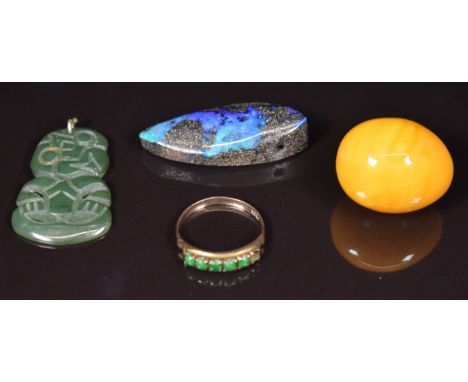 A 14k gold ring set with jadeite (1.4g, size J), a Maori tiki pendant, amber egg and opal boulder pendant&nbsp;