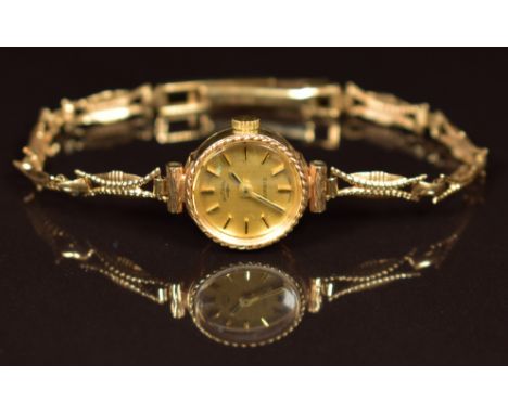 Rotary&nbsp;9ct gold ladies wristwatch with two-tone hands and baton hour markers, gold dial and quartz movement, on 9ct gold