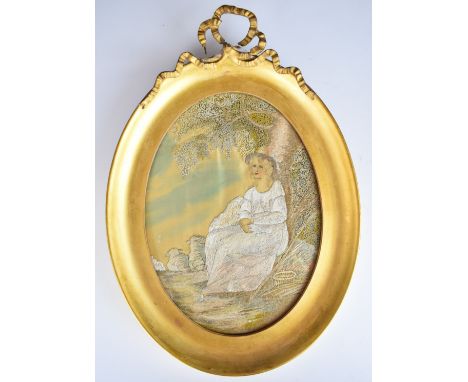 19th century needlework or tapestry picture of a lady seated beside a tree in a meadow with basket and stick beside her and s
