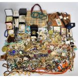A collection of costume jewellery including silver chains, vintage brooches, malachite necklace,