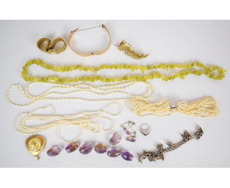 A collection of jewellery including peridot necklace, silver charm bracelet, rolled gold bangle, freshwater pearl necklaces, 