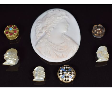 Three mother of pearl studs / buttons in the form of men, a cameo depicting a young woman, yellow metal button / stud set wit