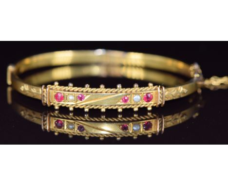 Victorian 9ct gold bangle set with garnets and pearls, 7.1g, 5.8 x 4.7cm&nbsp;