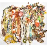 A collection of costume jewellery including earrings, necklaces including agate and mother of