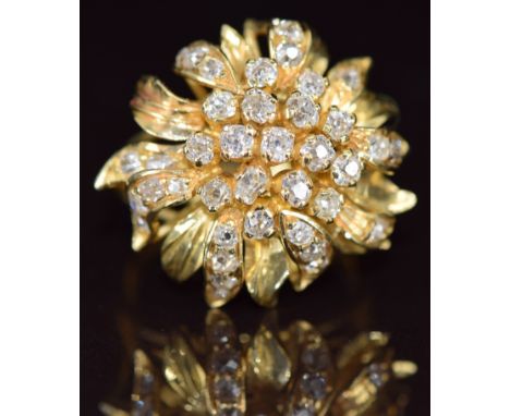 A bespoke 18ct gold ring in the form of a flower set with old cut diamonds, 9.4g, size O