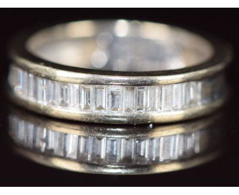 An 18ct white gold half eternity ring set with baguette cut diamonds, the total diamond weight approximately 0.5ct, 5.9g, siz