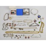 A collection of silver including gilt curb link necklace and bracelet, ten bracelets, bangle,