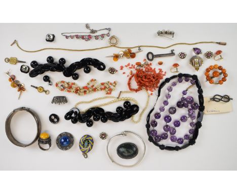 A collection of jewellery including 9ct gold clip (1.8g), amethyst beaded necklace, silver bangle, sections of jet necklace, 