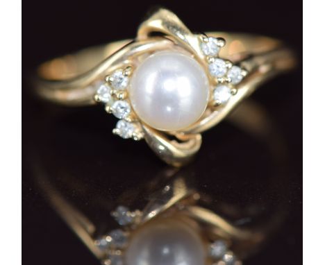 A 9k gold ring set with a cultured pearl and diamonds, 2.8g, size R&nbsp;