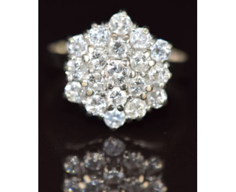 An 18k gold ring set with round cut diamonds in a hexagonal cluster, the total diamond weight approximately 1.75ct, 6.9g, siz