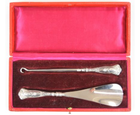 Cased Art Nouveau hallmarked silver handled button hook and shoe horn, import marks for Birmingham 1909, maker / importer's m