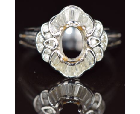 An 18k white gold ring set with round and baguette cut diamonds (missing centre stone), 4.2g, size W