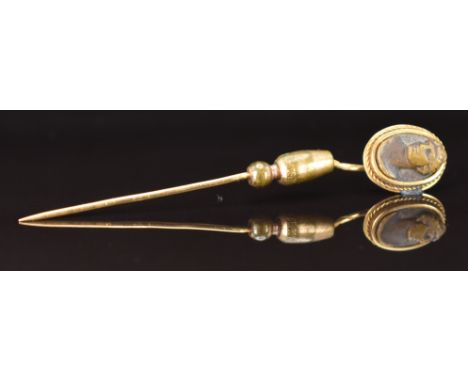 Victorian yellow metal stick pin set with a lava cameo, in antique box