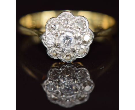 An 18ct gold ring set with a cluster of diamonds, 2.8g, size R