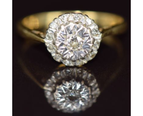 An 18ct gold ring set with diamonds in a cluster, 3.1g, size J