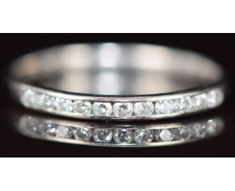 A 9ct white gold eternity ring set with diamonds, 1.3g, size L