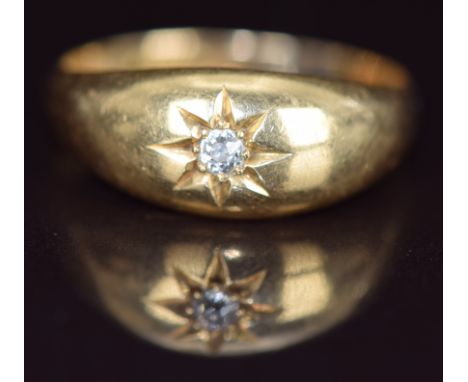 An 18ct gold ring set with a diamond in a star setting, Birmingham 1911, 2.8g, size O