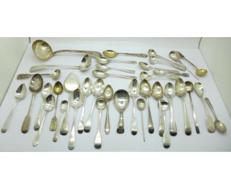 A collection of silver spoons including 19th Century condiment spoons and two Scottish silver ladles, 570g, (Georgian caddy s