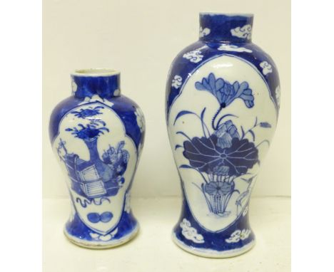 Two Chinese porcelain blue and white vases, largest with Kangxi mark, 19cm and smaller vase 14cm, a/f (hairline crack to rim)