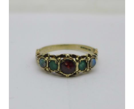 A 9ct gold, garnet, emerald and opal ring, 2.4g, P 