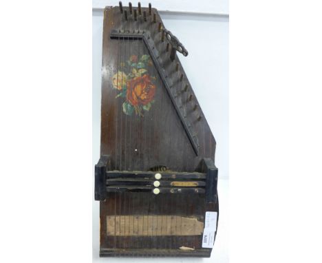 An auto-harp, lacking two strings 