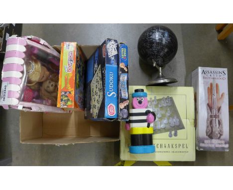 A collection of toys and games including Chad Valley, chess sets, Sudoku, Monopoly, Barbie head, a money box and a globe **PL