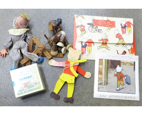 An Andy Pandy Pelham puppet, one other puppet (both sets of strings tangled) and Rupert the Bear items 