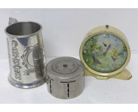 A Smiths novelty alarm clock, a Yorkshire Penny Bank Ltd. money bank and a pewter tankard, Kings and Queens 