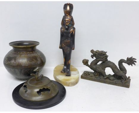 A Chinese censer, a Middle Eastern bronze pot, a Chinese brass dragon figure and an Egyptian figure 