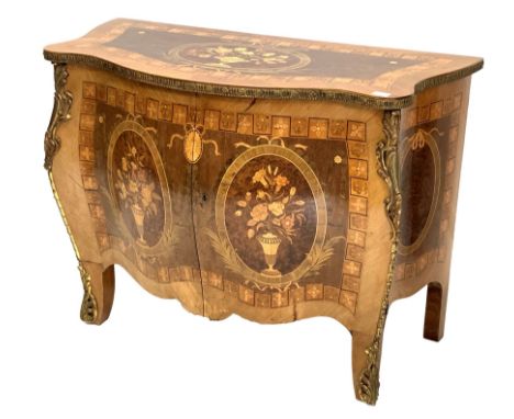 French Louis XV design kingwood commode of serpentine outline with floral marquetry inlay and enclosed by pair of panelled do