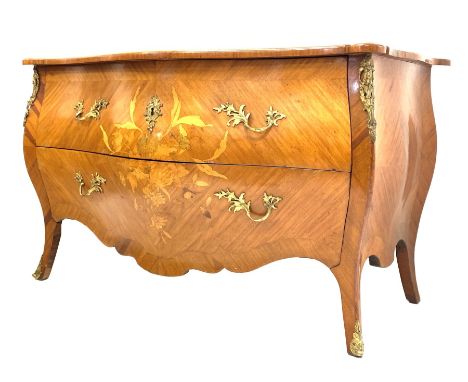 French Louis XV design commode of serpentine outline and with inlaid decoration, fitted with two drawers, gilt metal mounts a