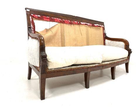 Regency mahogany three seat sofa, cresting rail carved with scrolls and gadroon moulding, the arm rests in the form of scaled